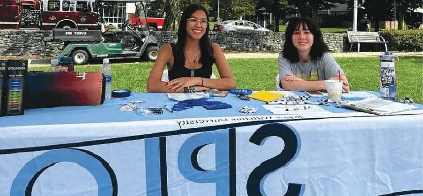 Students sitting at SPLO involvement table